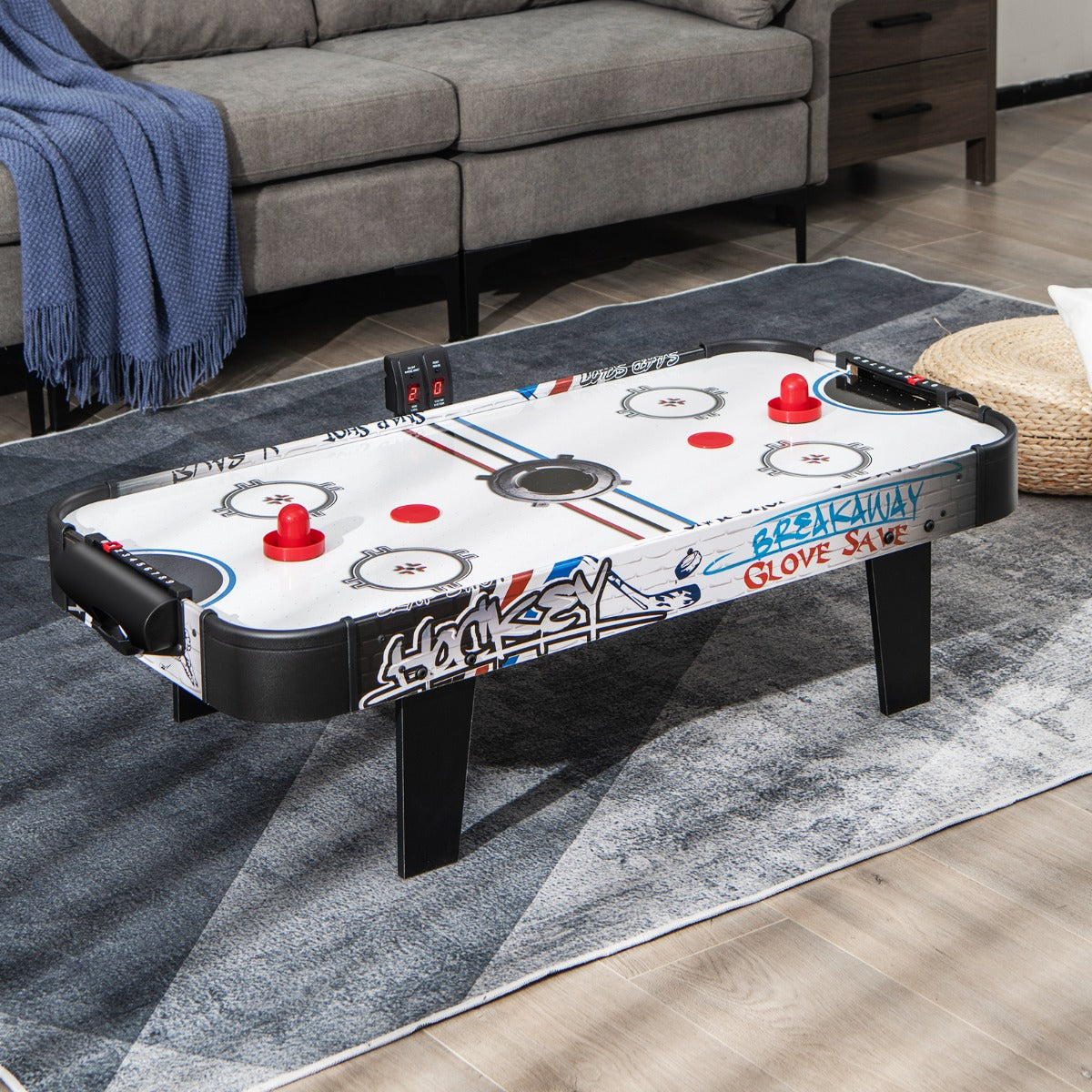 Kids air hockey table with LED scoreboard for home entertainment and fun play. Kids air hockey table with LED scoreboard for home entertainment and fun play.