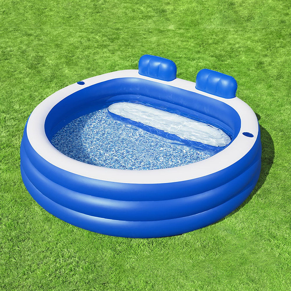 Inflatable kids pool with bench seat and cup holders, perfect for summer fun at home.