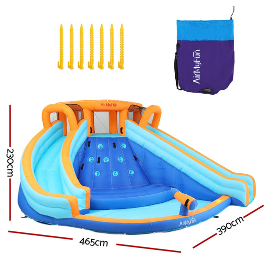 Large inflatable water park with double slides and jumping castle for outdoor summer fun and entertainment.