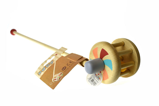 Wooden push-a-long maroon toy for toddlers, promotes balance and coordination skills at home.