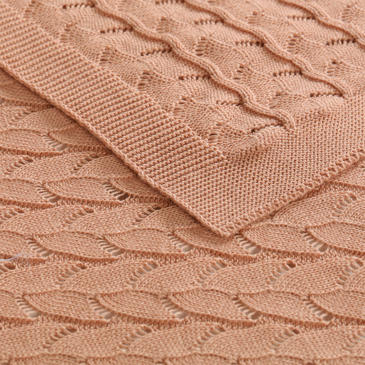 Organic cotton baby blanket in dusty pink, soft & gentle for cozy snuggles.