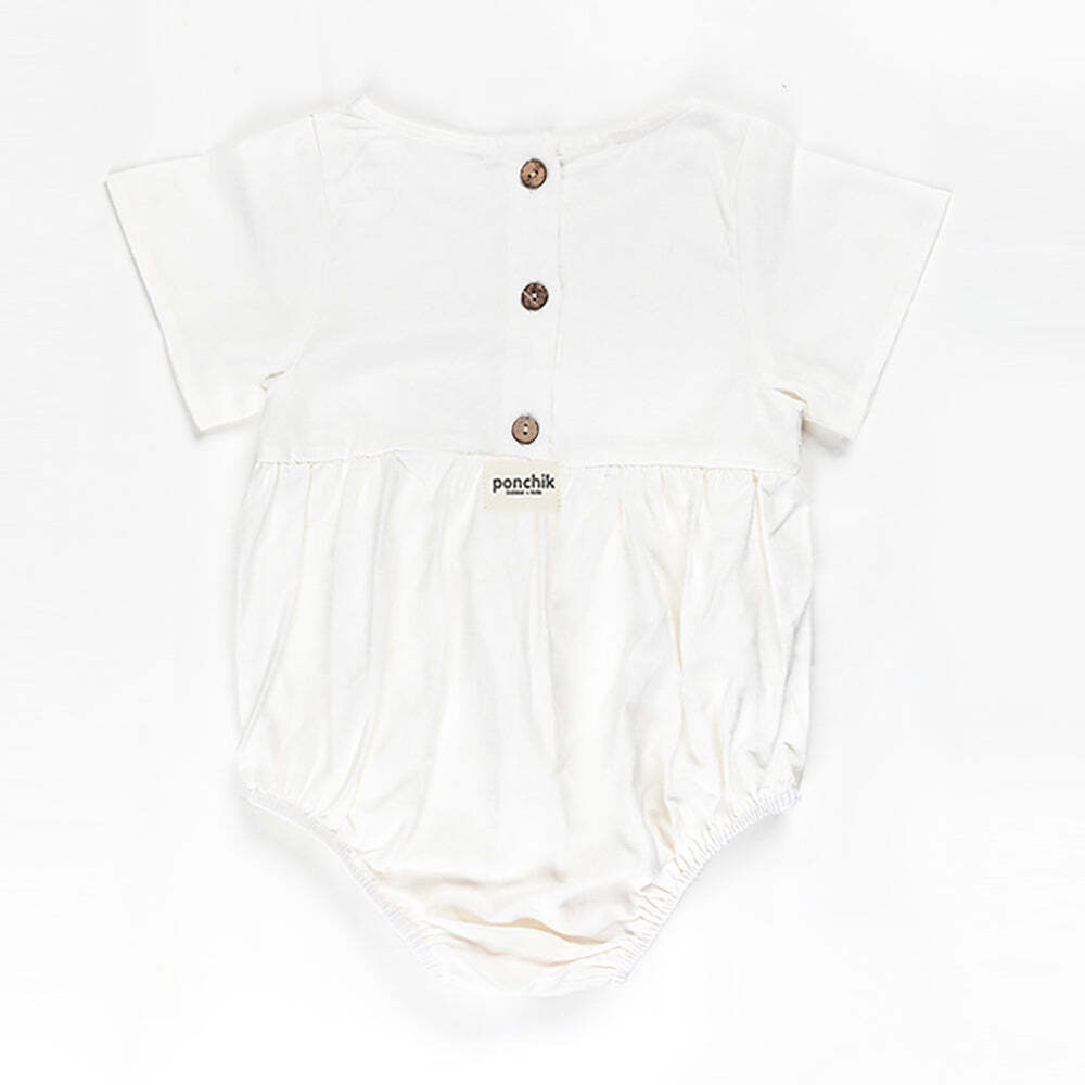 Ponchik Babies + Kids Linen Daisy Romper in size 2 years old, perfect for home play.