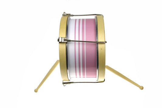 Pink marching drum toy for children, inscribed with lilies, creating a classic, calming design.