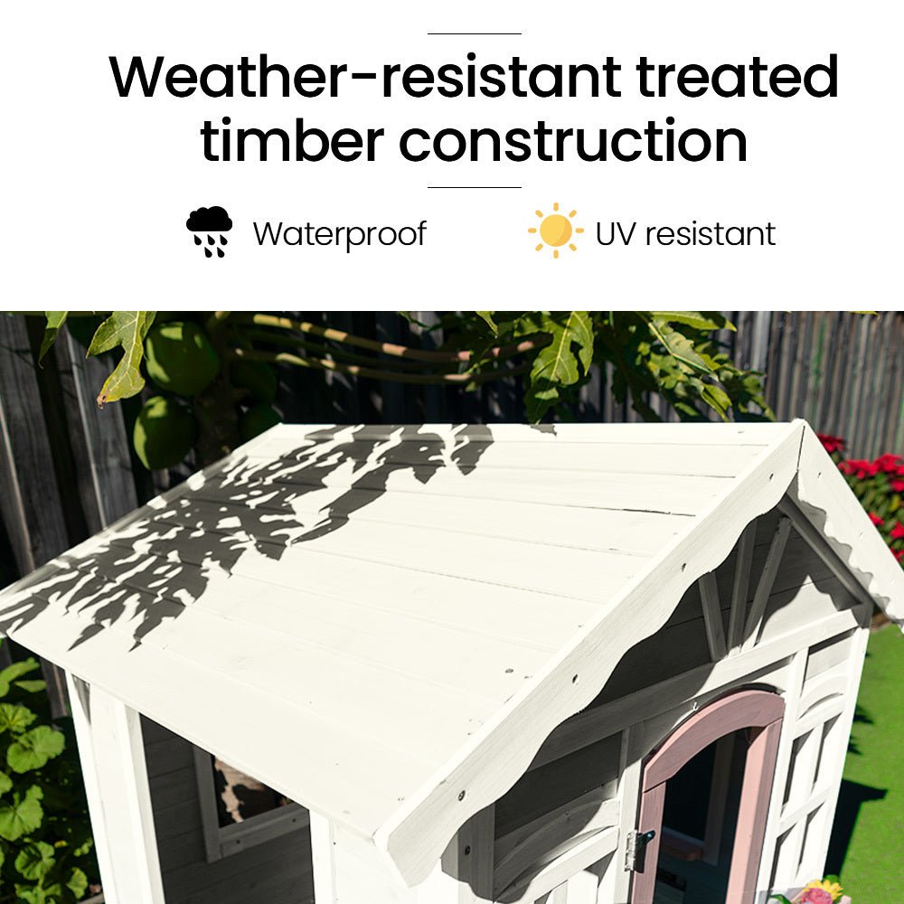 White and pink cottage cubby house for kids, perfect for imaginative play at home