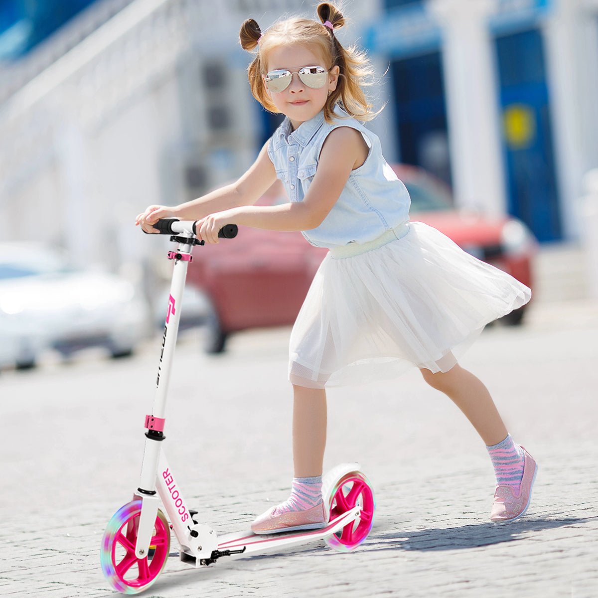 Foldable and adjustable pink LED wheel scooter for kids, perfect for fun at home. Foldable and adjustable pink LED wheel scooter for kids, perfect for fun at home.