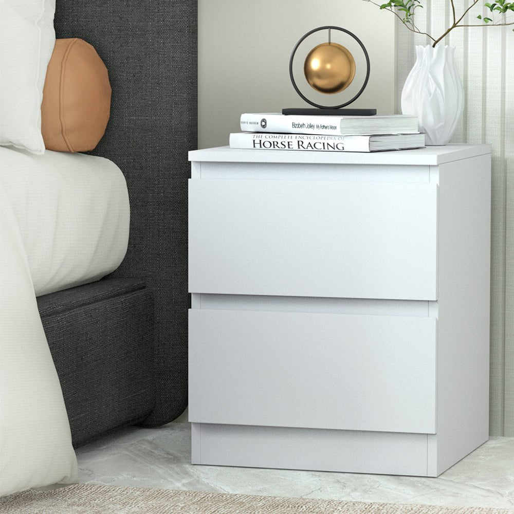 Kids white bedside table with drawers for storing toys and books, perfect for childrens room.
