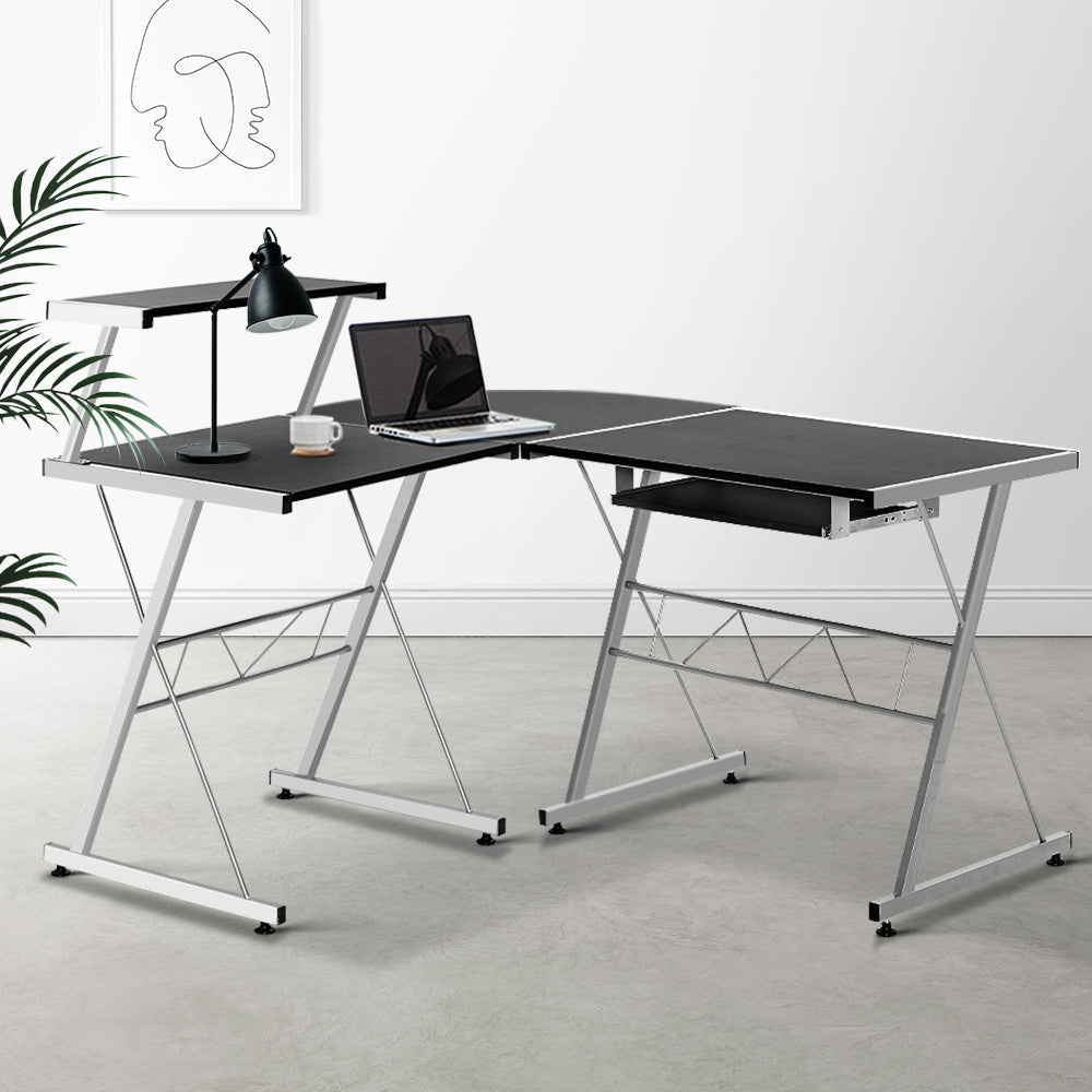Modern L-shaped black desk for kids and adults, ideal for home offices and studies. Modern L-shaped black desk for kids and adults, ideal for home offices and studies.