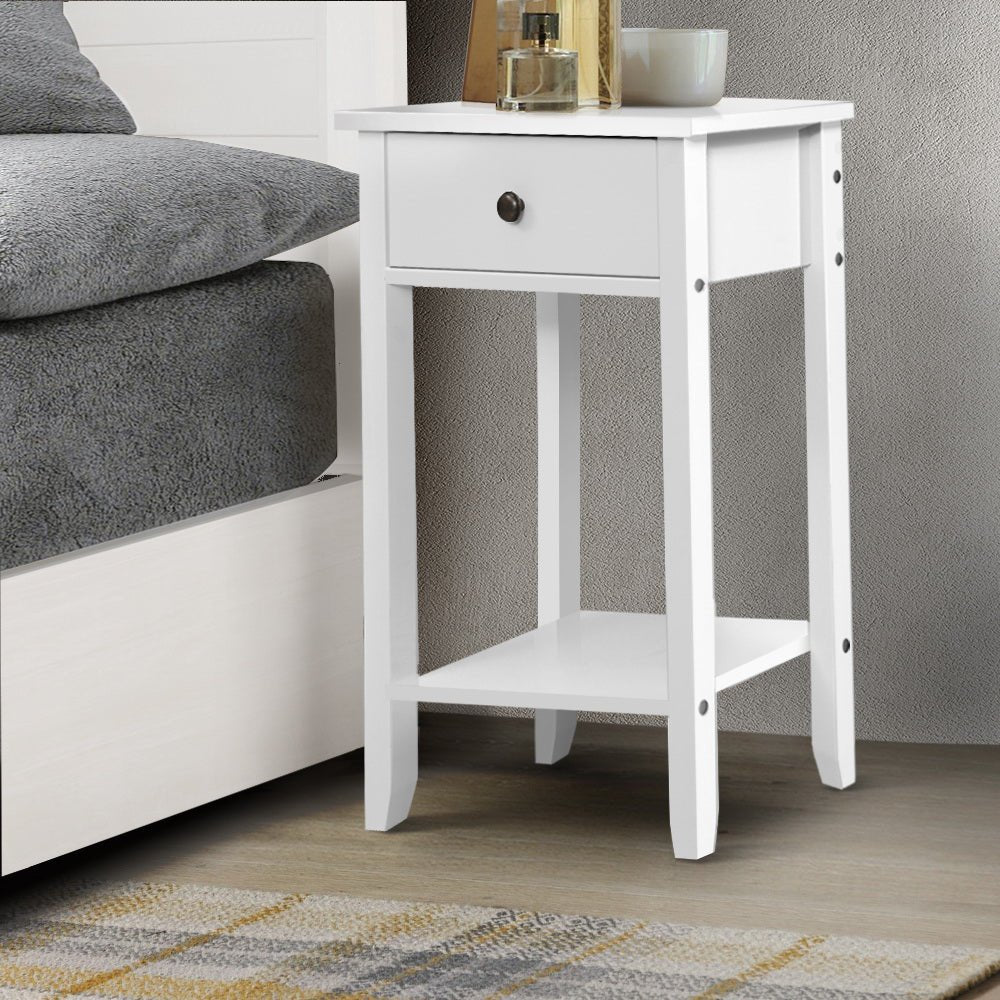 Kids white bedside table with drawer for storage, ideal for childrens bedroom organization. Kids white bedside table with drawer for storage, ideal for childrens bedroom organization.