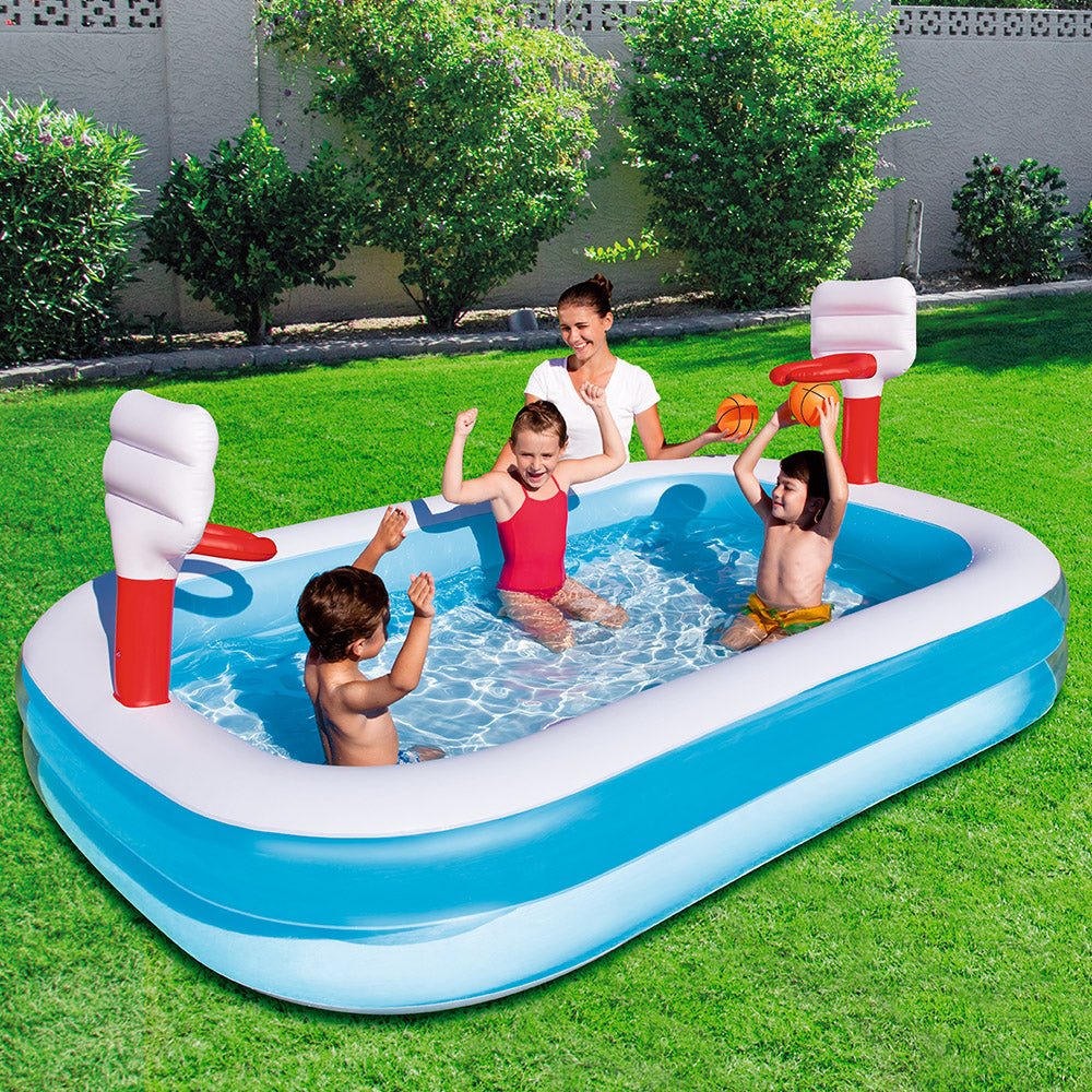 Inflatable pool with basketball hoops for fun summer play in kids backyard.