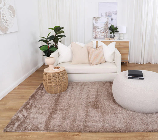 Soft shaggy beige rug perfect for kids room, cozy and playful addition to decor.