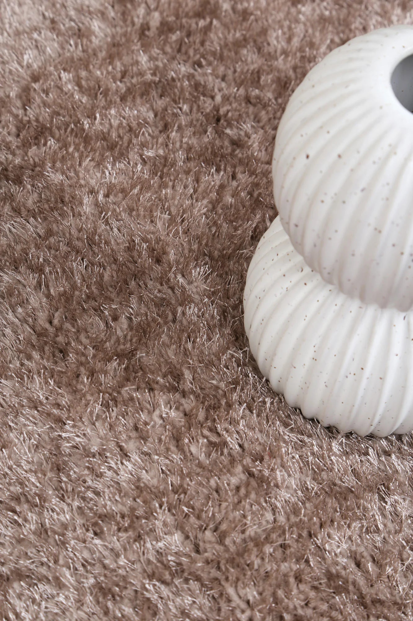 Soft and cozy Brendon Beige Shaggy Rug, perfect for kids playrooms and bedrooms. Machine washable.