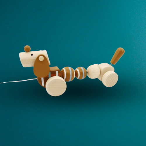 Pull along sausage dog toy for kids, promotes calm playtime with breezy design. Pull along sausage dog toy for kids, promotes calm playtime with breezy design.