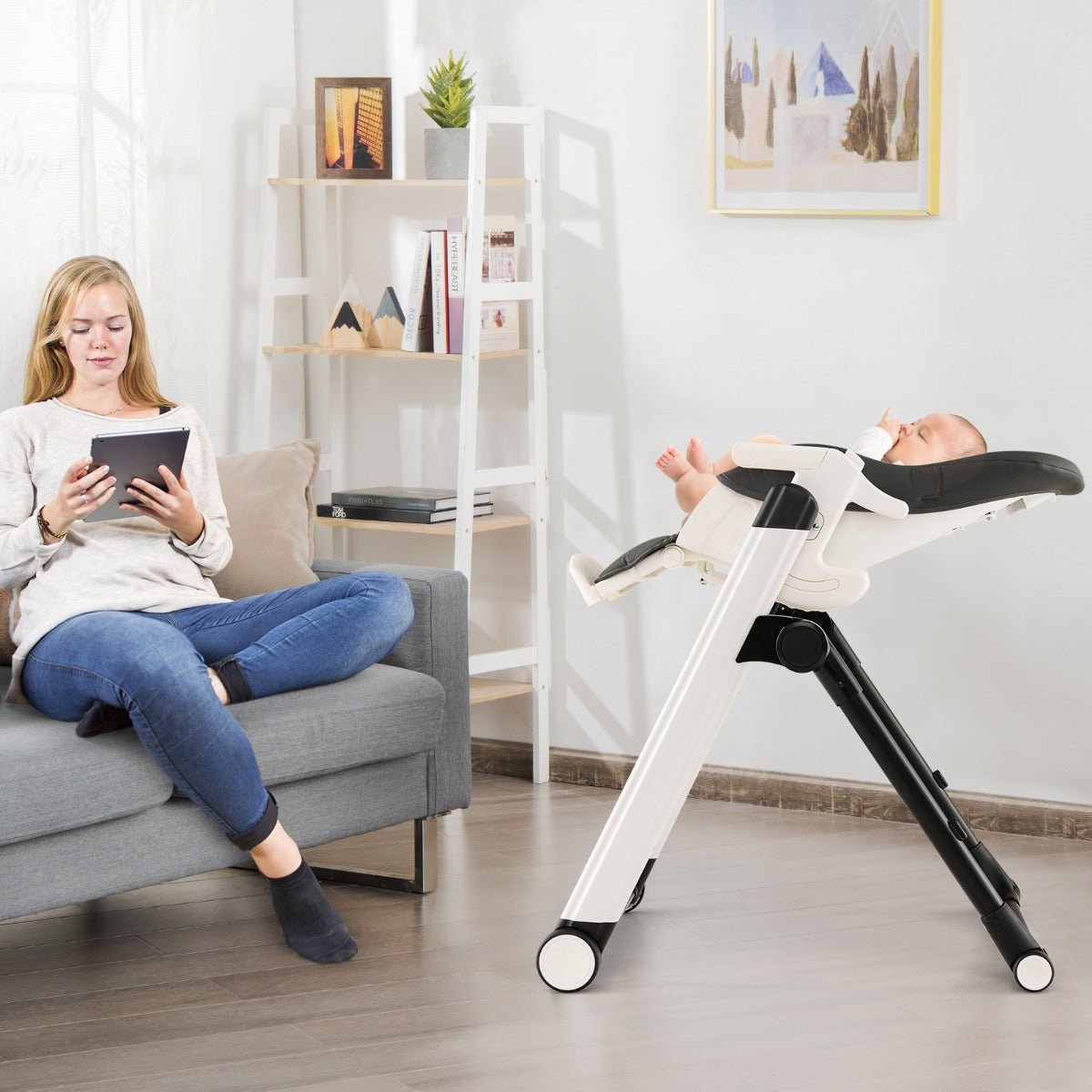 Foldable high chair with recline and wheels for adjustable comfort and convenience at home.