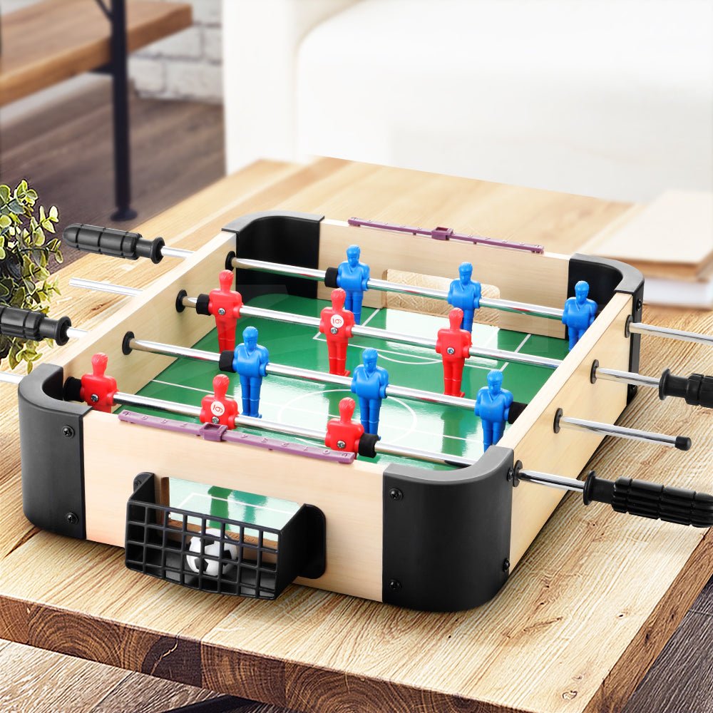 Mini foosball table with soccer ball and portable design for kids home entertainment. Mini foosball table with soccer ball and portable design for kids home entertainment.