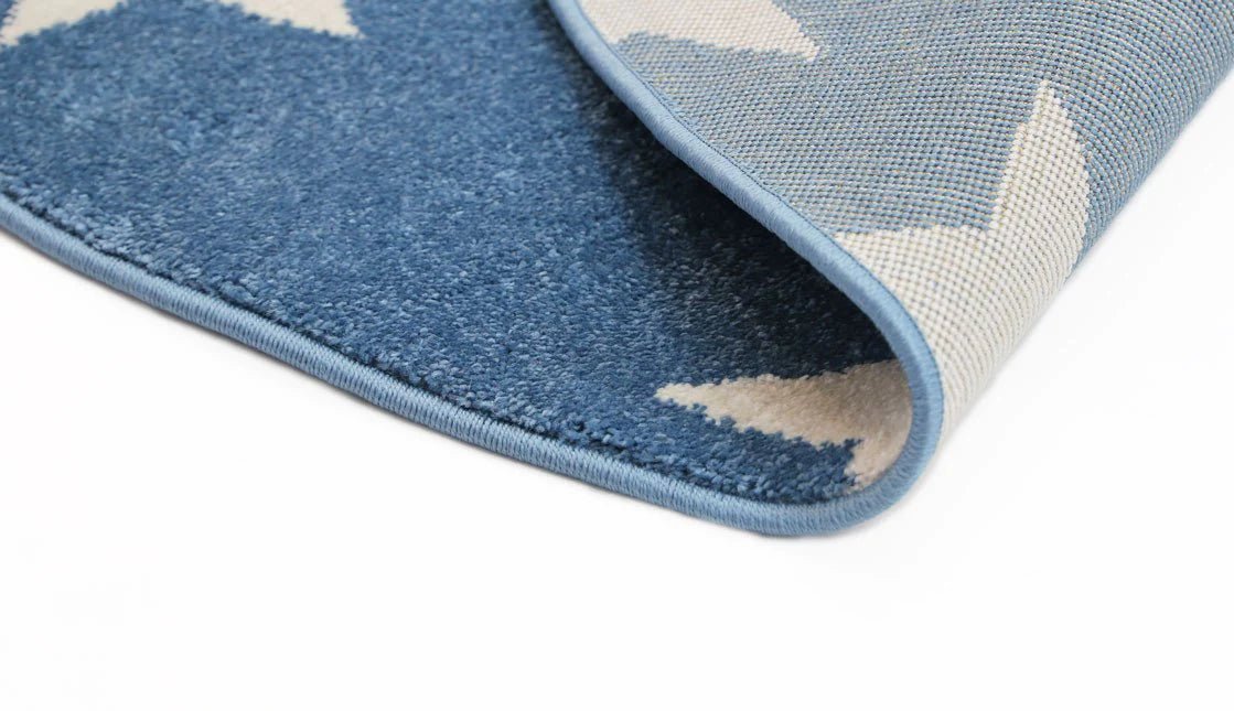 Blue and white kids rug with playful stars pattern, perfect for childrens bedroom or playroom. Blue and white kids rug with playful stars pattern, perfect for childrens bedroom or playroom.