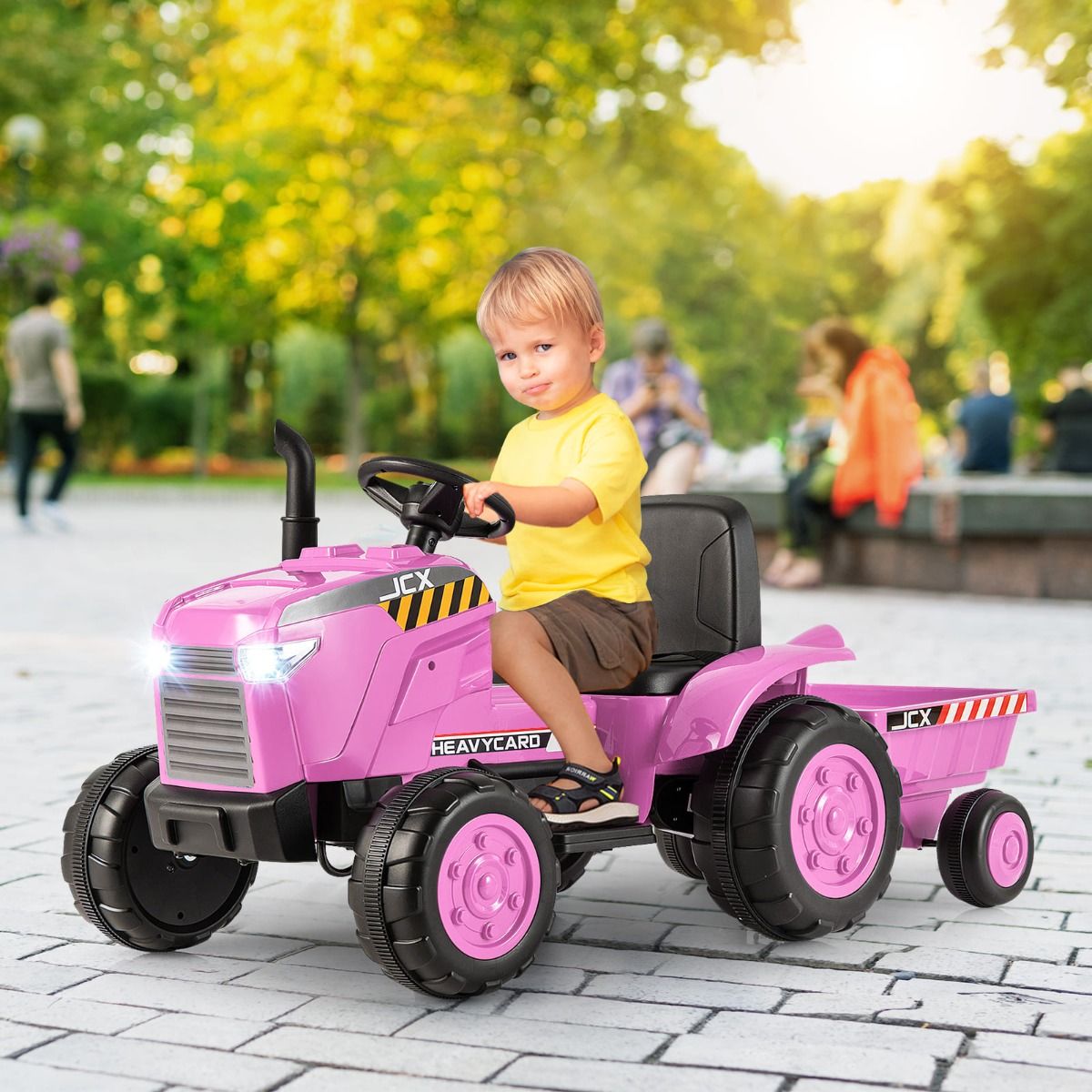 Pink 12V Kids Electric Tractor with Trailer and Remote Control for imaginative play at home.