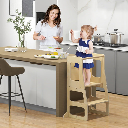 Wooden toddler kitchen tower and step stool for safe learning and independent cooking activities.