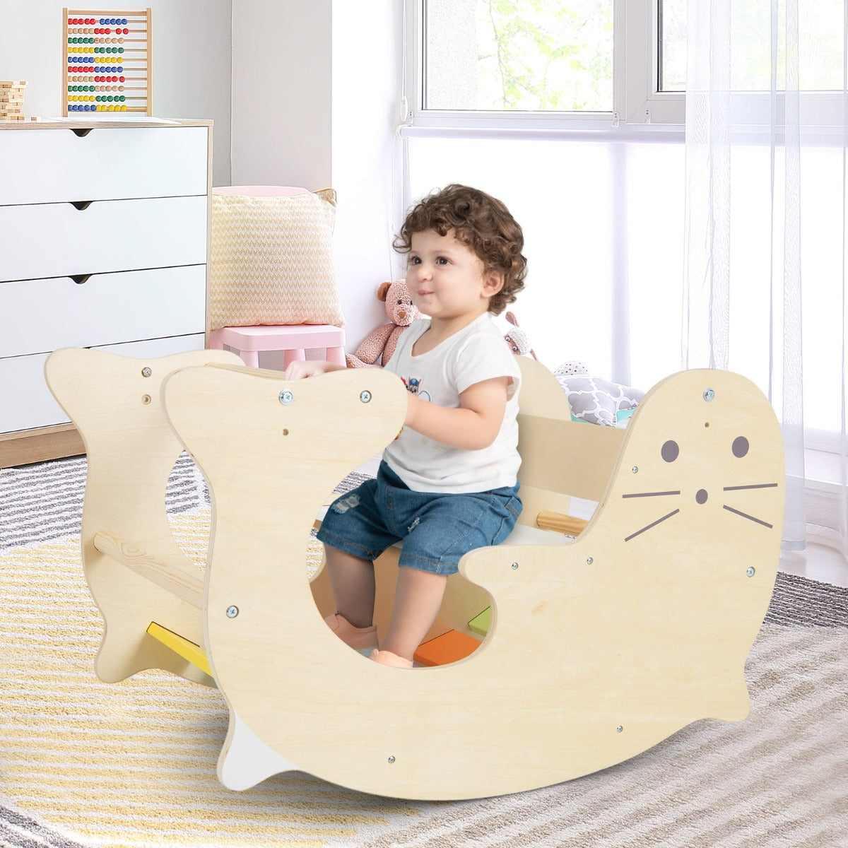 Childrens wooden play set with climbing arch, rocking horse, and play table. Home-friendly interactive fun.