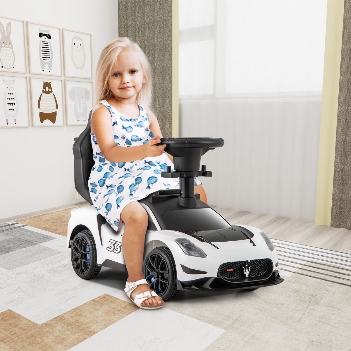 White Maserati-style ride-on push car with musical steering wheel for interactive and stylish playtime fun.