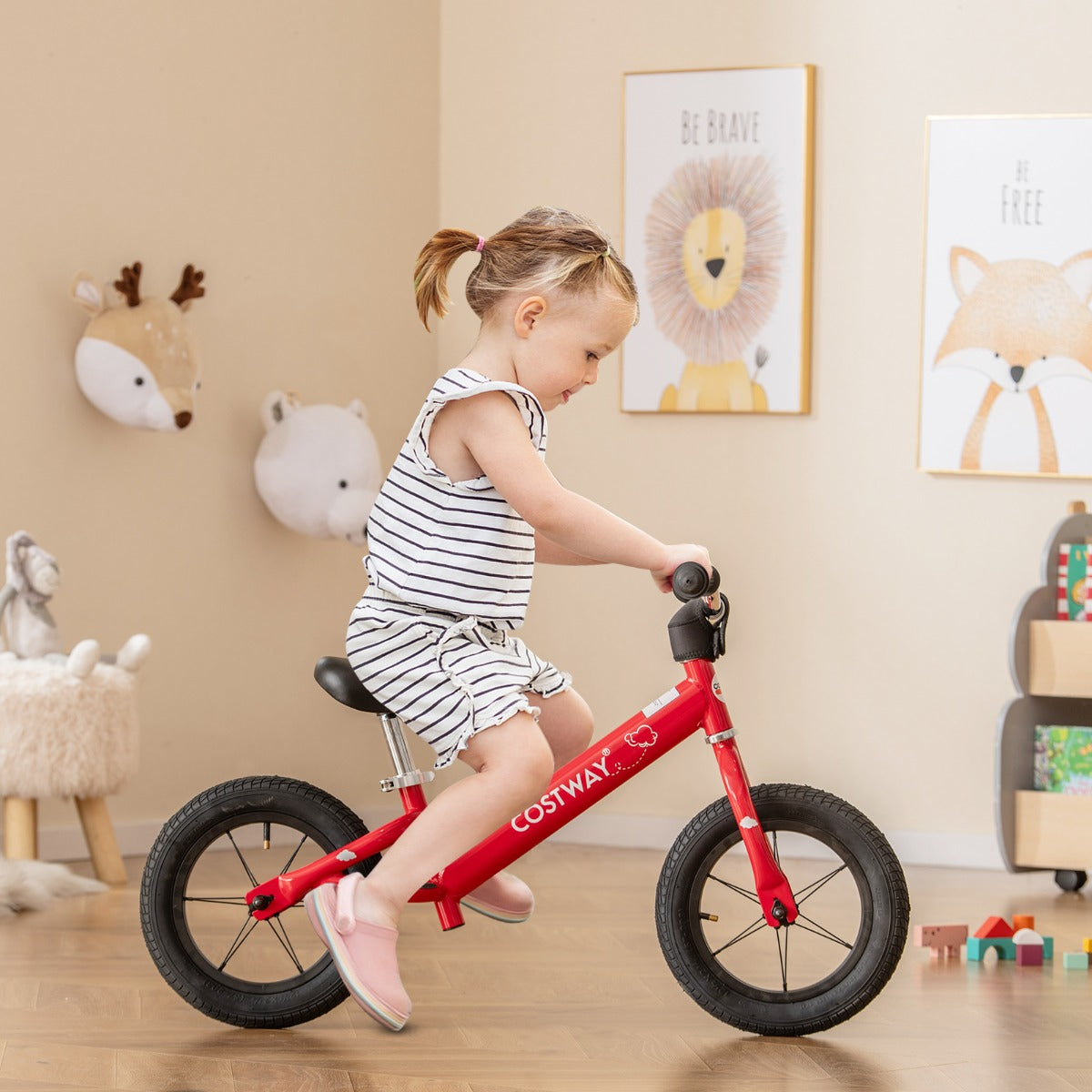 Red 30cm toddler balance bike for indoor and outdoor fun, promoting early bike skills.