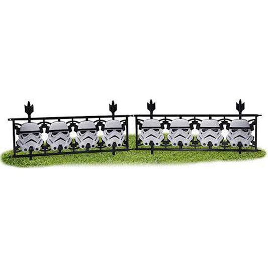 Star Wars Stormtrooper helmet fence panels for kids party decor and play area.