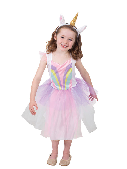 Child wearing a colorful unicorn costume on a white background
