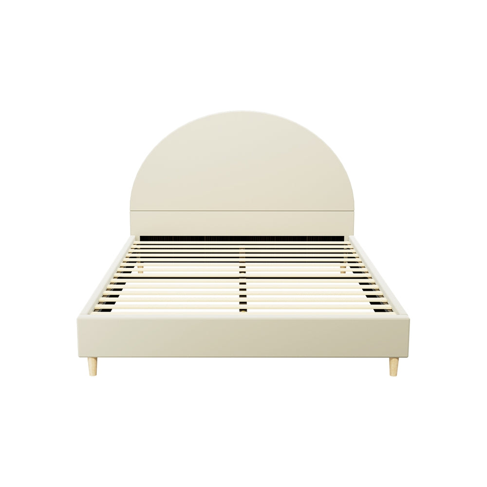 Cream double velvet bed frame with arched headboard, ideal for childrens bedroom decor.
