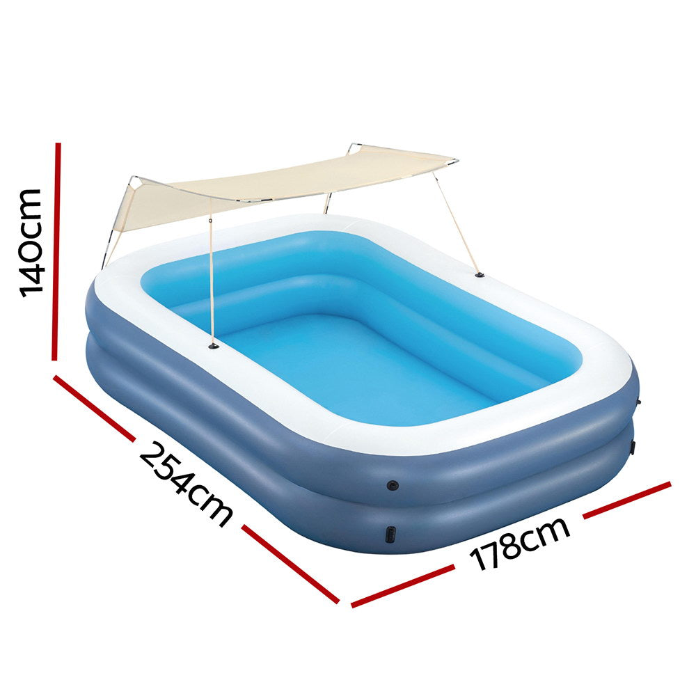 Inflatable kids pool with sunshade, sized 254x178cm, perfect for summer fun at home.