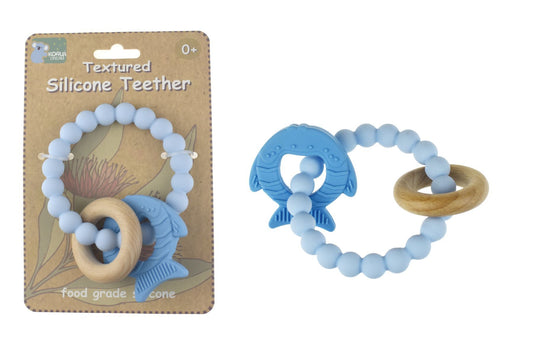 Blue silicone teether designed as a fish by Koala Dream for soothing infants gums.