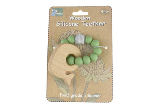 Wooden silicone whale teether in green, perfect for babies to soothe sore gums.