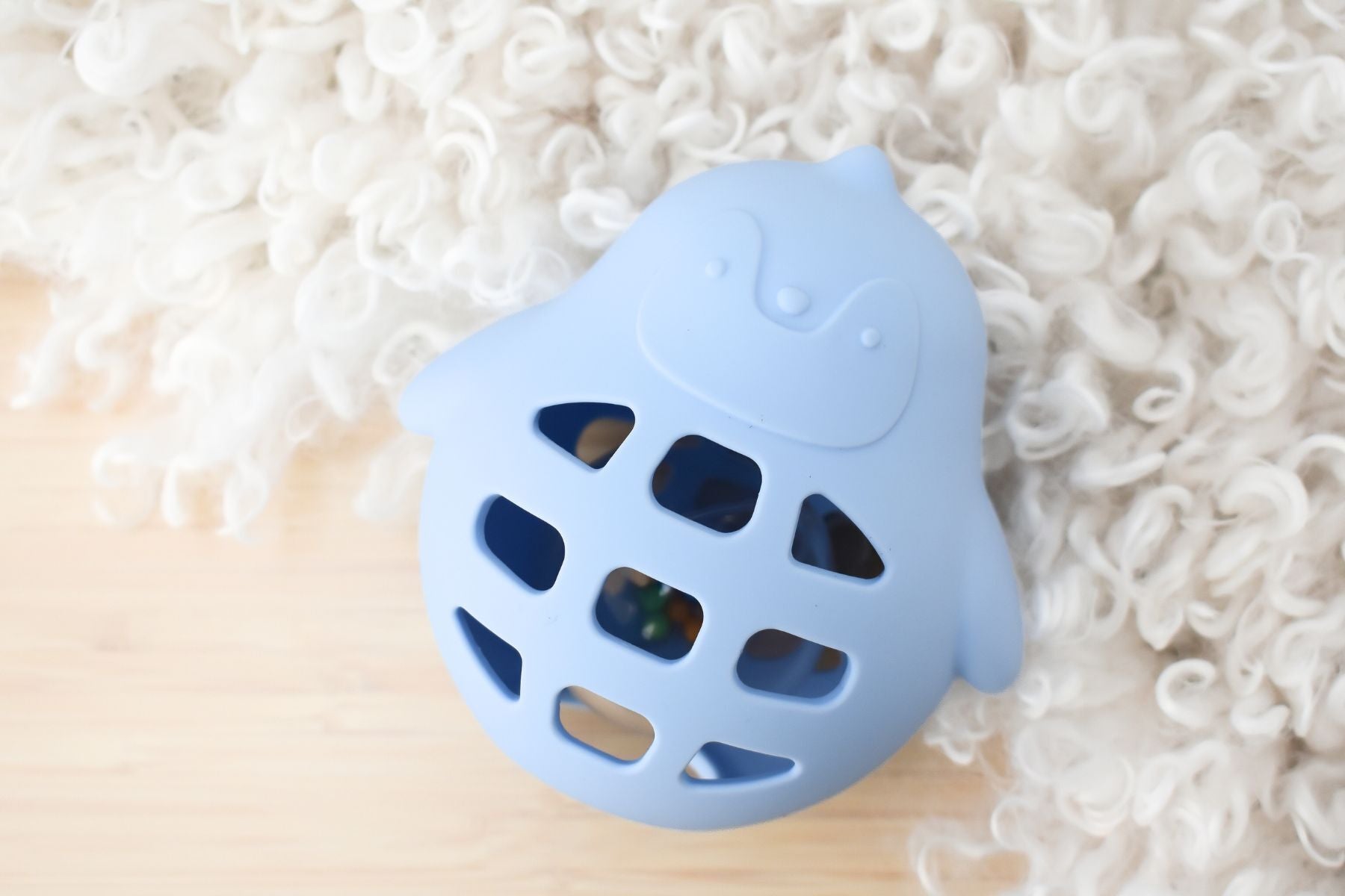 Koala Dream blue silicone penguin rattle, a sensory baby toy for stimulating playtime.