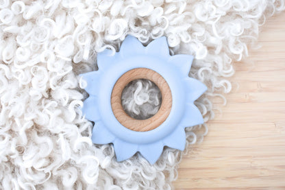 Blue Sunflower Teether for Babies made of silicone & wood for soothing.