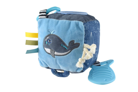 Whale-shaped baby pram toy with sensory features, perfect for stimulating infants at home.