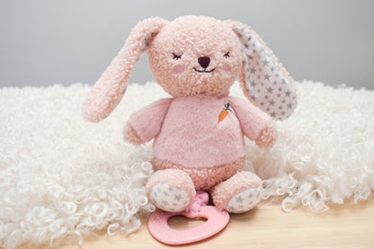 Snuggle Buddy Berry Bunny Jiggler Teether Pram Toy for soothing playtime at home.