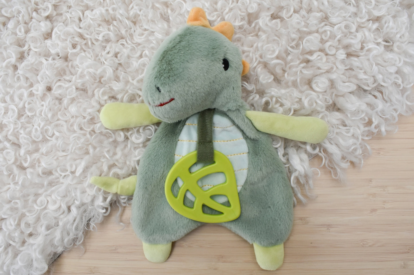 Minty Dinosaur plush with teether for soothing and play, ideal for childrens comfort at home.