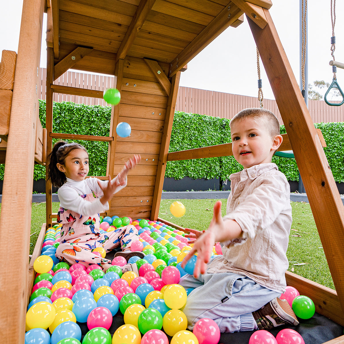 Blue Birmingham outdoor play set featuring swings and slide for active childrens backyard fun and adventure.