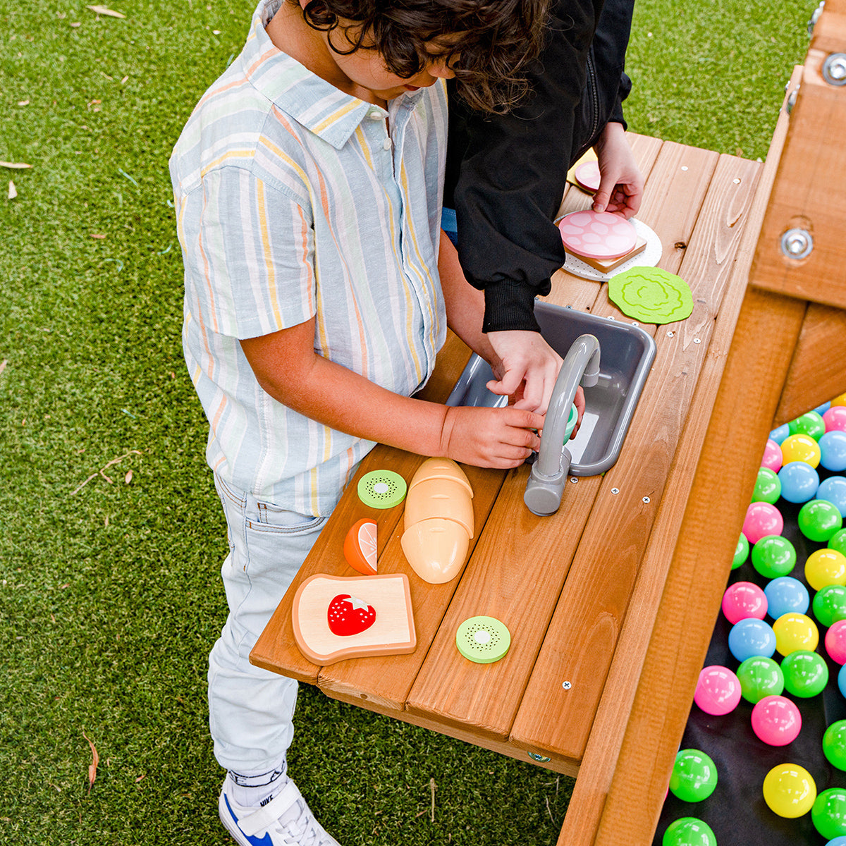 Birmingham outdoor play set featuring a blue slide and swings for endless backyard adventures.