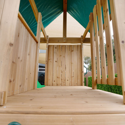 Carindale playground set featuring swings and a green slide for outdoor fun and active play.