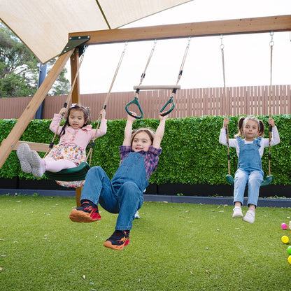 Backyard playtime on the Carindale play centre with swings and slide