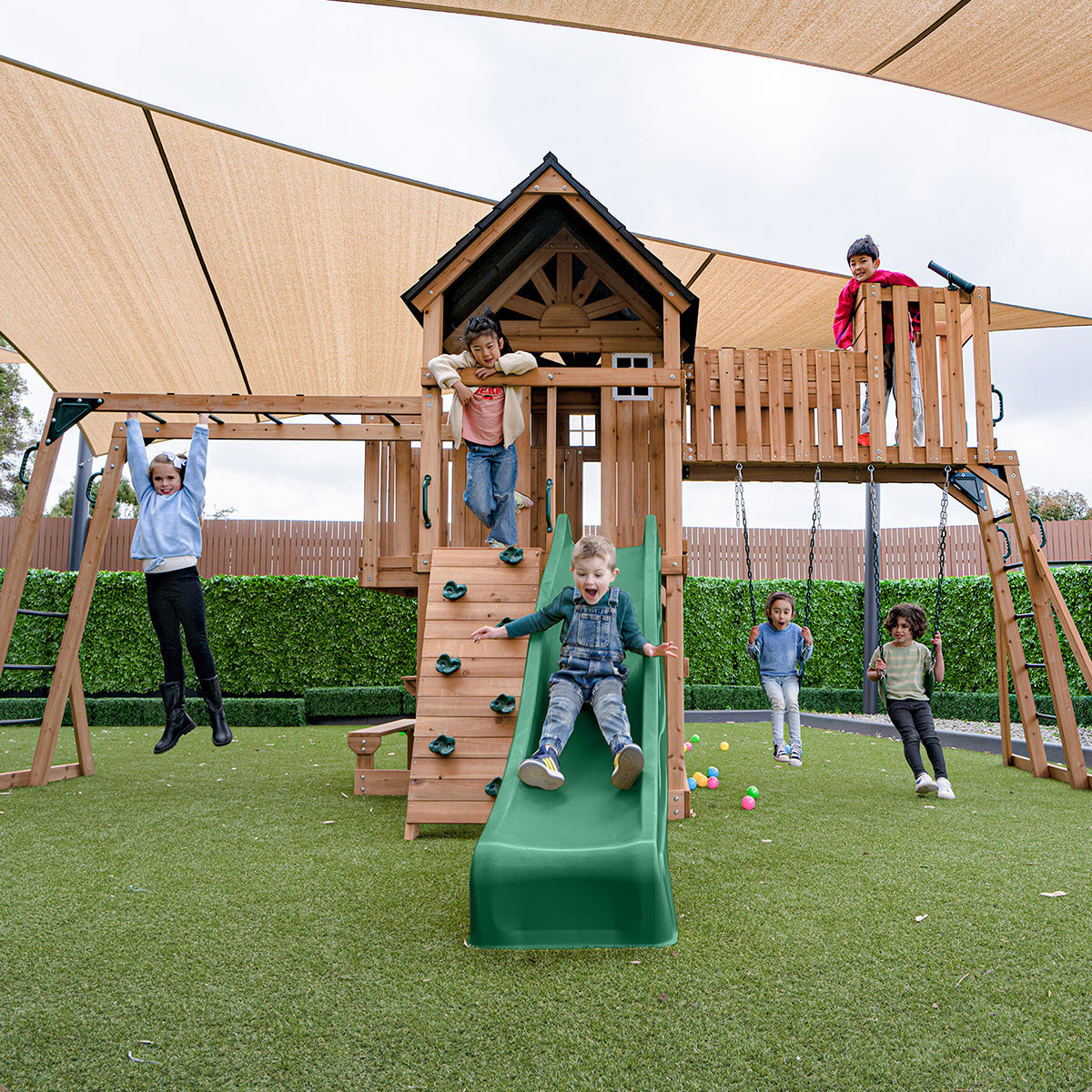 Kensington Adventure Playset features a 2.2m green slide and multiple play areas for outdoor fun and exploration.