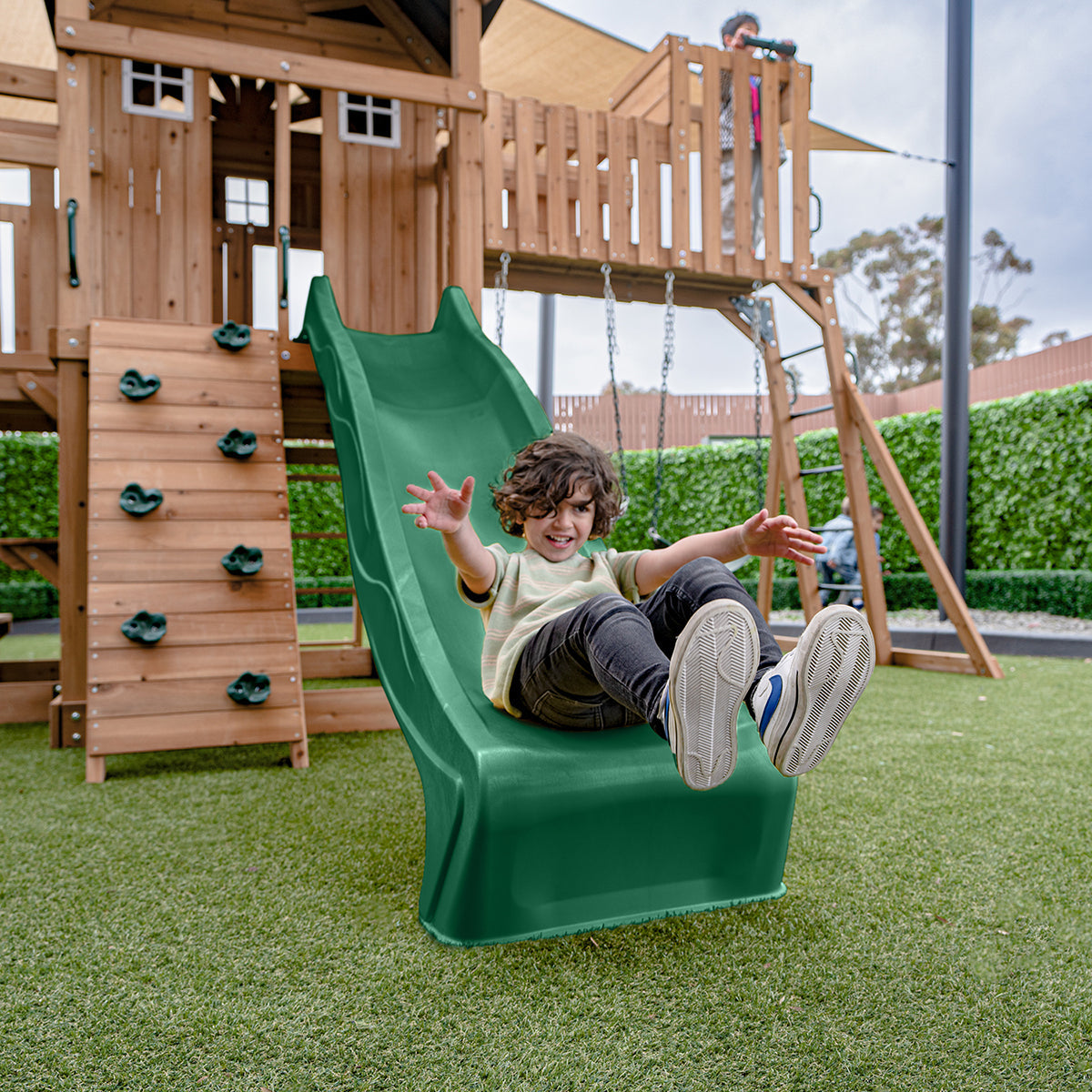 Kensington Adventure Playset features a 2.2m green slide and multiple play areas for outdoor fun and exploration.