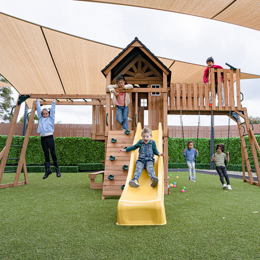 Colorful outdoor play center featuring a yellow slide and monkey bars for active backyard adventures.