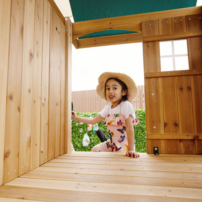 Child climbed the step ladder of the Lifespan Kids Montrose Play Centre, heading to the upper fort.