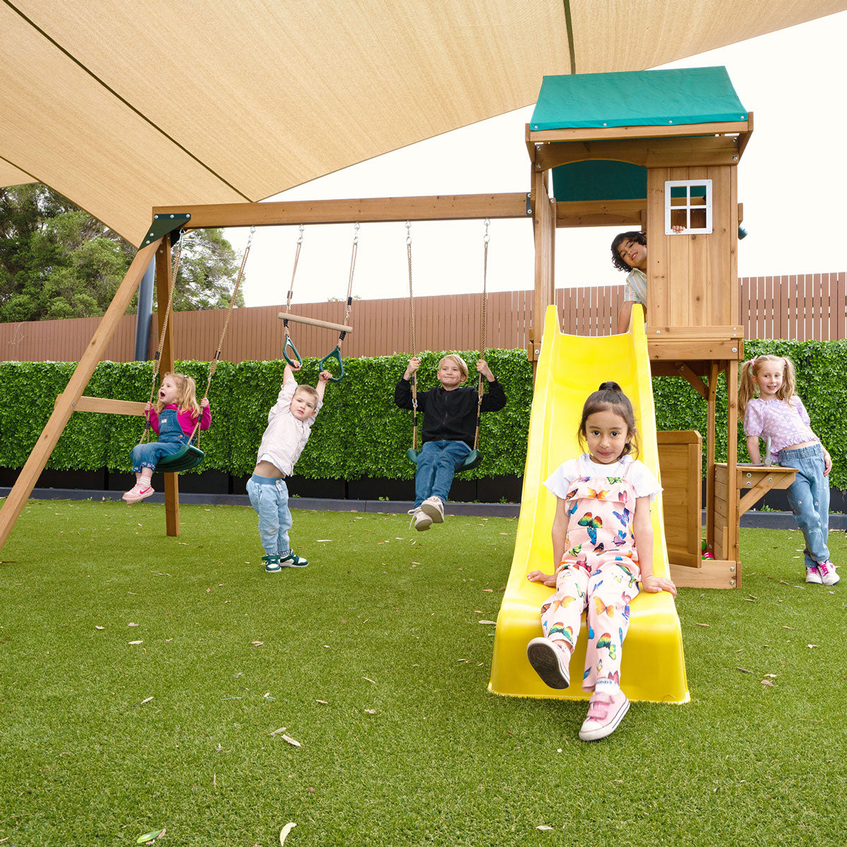 Montrose outdoor playground set featuring a yellow slide for active, imaginative backyard fun and exercise.