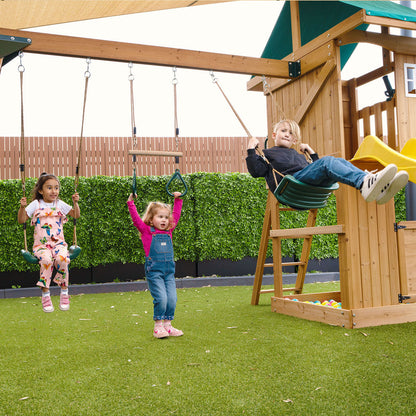 Montrose outdoor playground featuring a yellow slide, multiple play activities, and sturdy construction for.