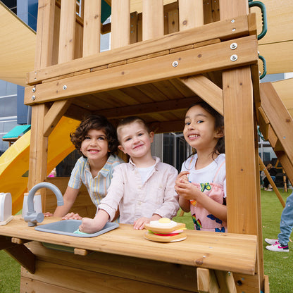 Montrose playground set featuring a tall yellow slide for outdoor fun and active play.