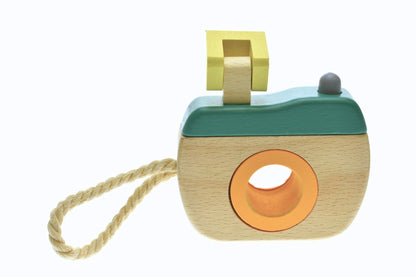 Wooden kaleidoscope camera toy in olive green for imaginative play at home for kids.