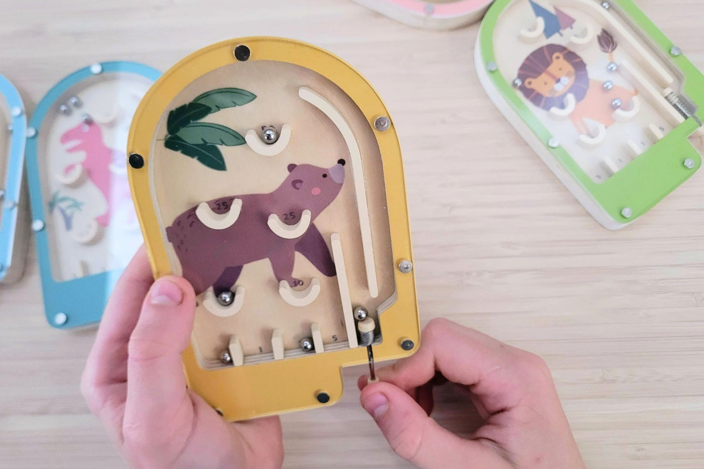 Handcrafted wooden pinball games, set of six, offer classic tabletop entertainment with nostalgic charm and skill-testing.