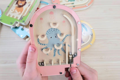 Set of six wooden tabletop pinball games offers classic entertainment with portable, eco-friendly design for.