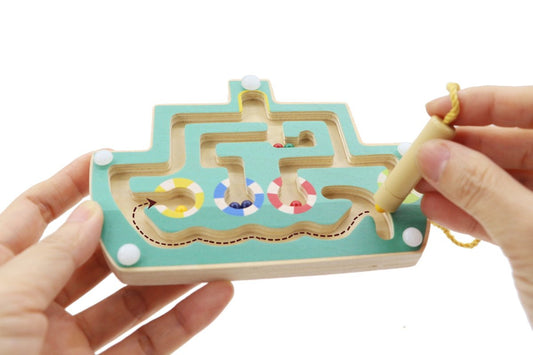 Colorful Wooden Boat Maze Puzzle with Magnetic pieces for interactive kids play at home.